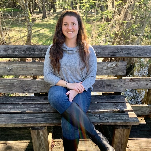 Brianna Coia sitting on a bench